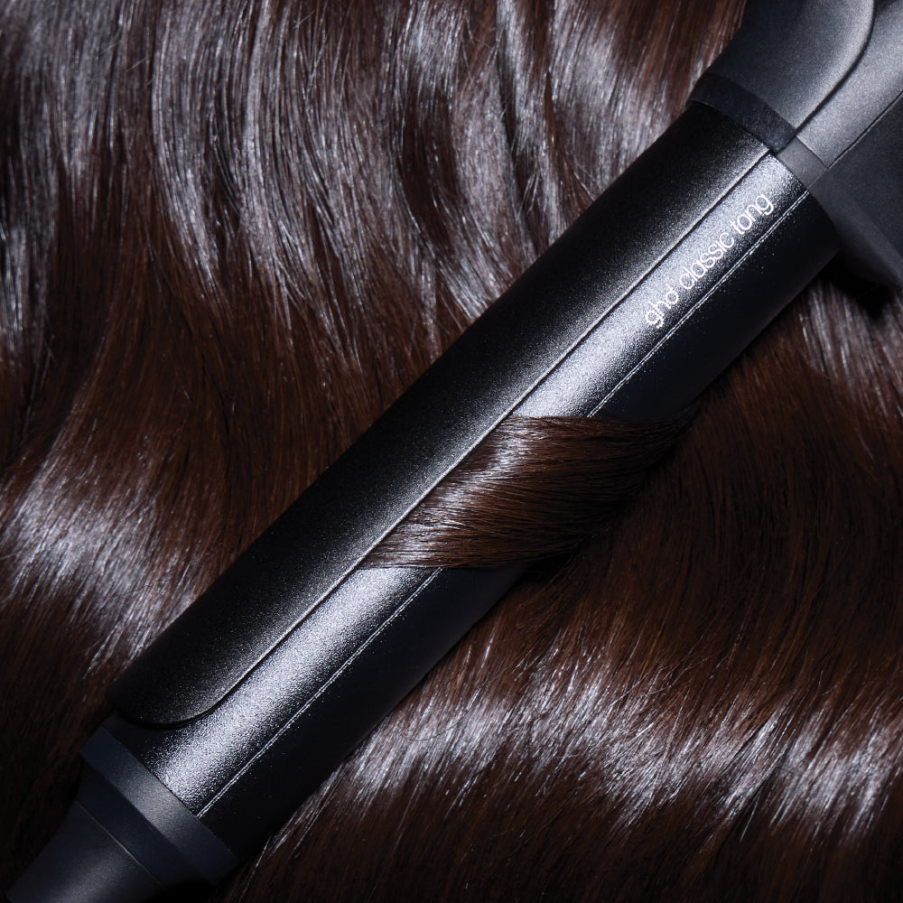 Black hair straightener on brown hair