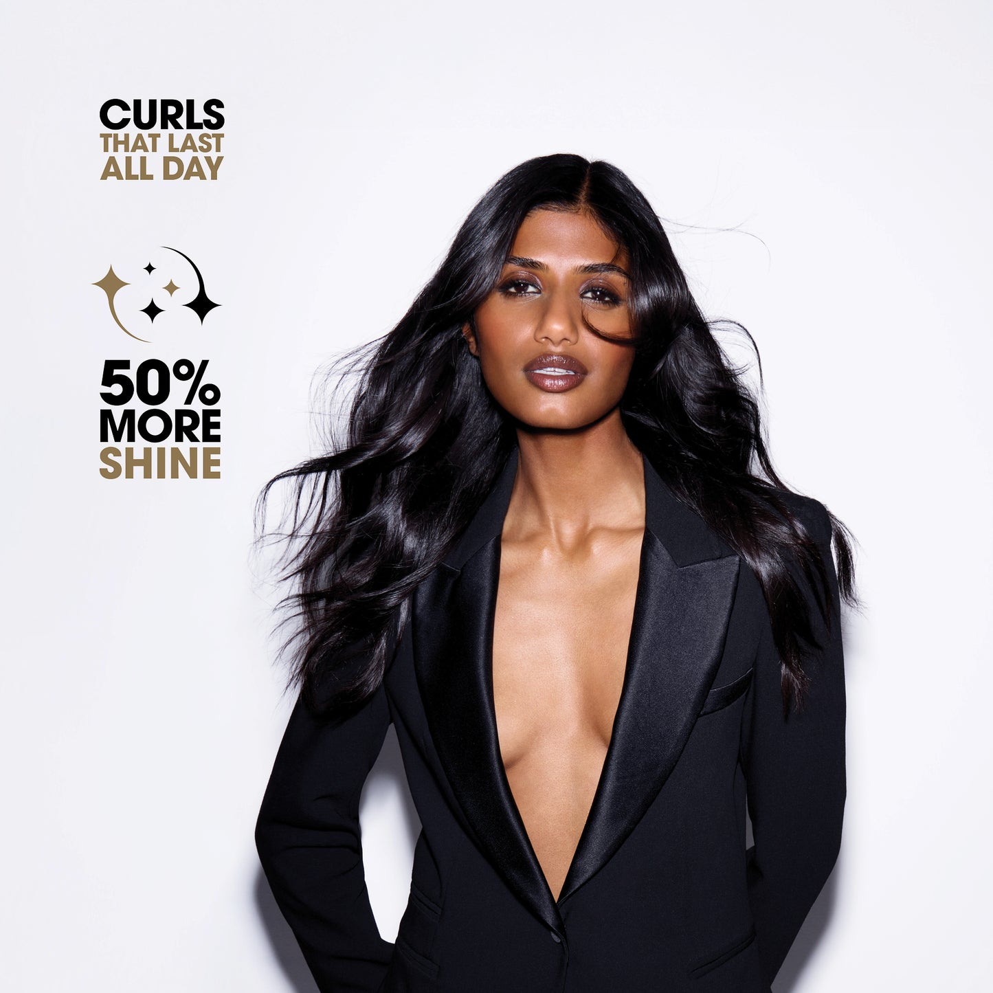 Woman with long, styled hair wearing a black suit against a white background with promotional text.
