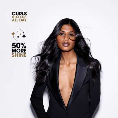 Woman with long, styled hair wearing a black suit against a white background with promotional text.