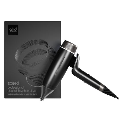 Black hair dryer with ghd logo next to its packaging on a white background